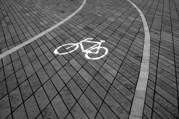 Bicycle path on stone pavement in city