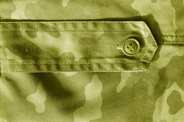 Part of military camo uniform in yellow tone.