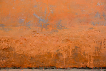 Naklejka premium terracotta Grunge wall of the old house. Texture, background