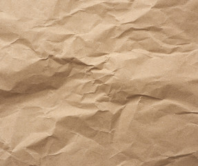 fragment of crumpled blank sheet of brown wrapping kraft paper