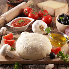 raw dough pizza with oil, tomato, olive, mushroom and cheese