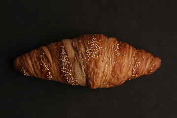 delicious spelled croissant in color background