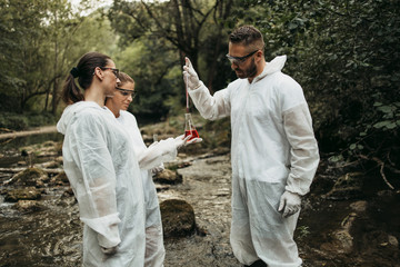 Team of scientists and biologists researching possibilities for bacteria and virus spreading through natural flowing supplies of drinking water.