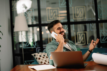 Businessman on coffee break using phone. Attractive man in office. 