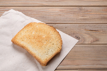 View of a white toast on wooden background