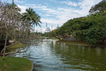 Sultan Salahuddin Abdul Aziz Shah Mosque in Shah Alam, Malaysia during blue skies sunny day with Shah Alam lake in foreground. It is also known as Blue Mosque.