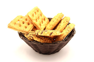 Composition of cookies in a basket on a white background