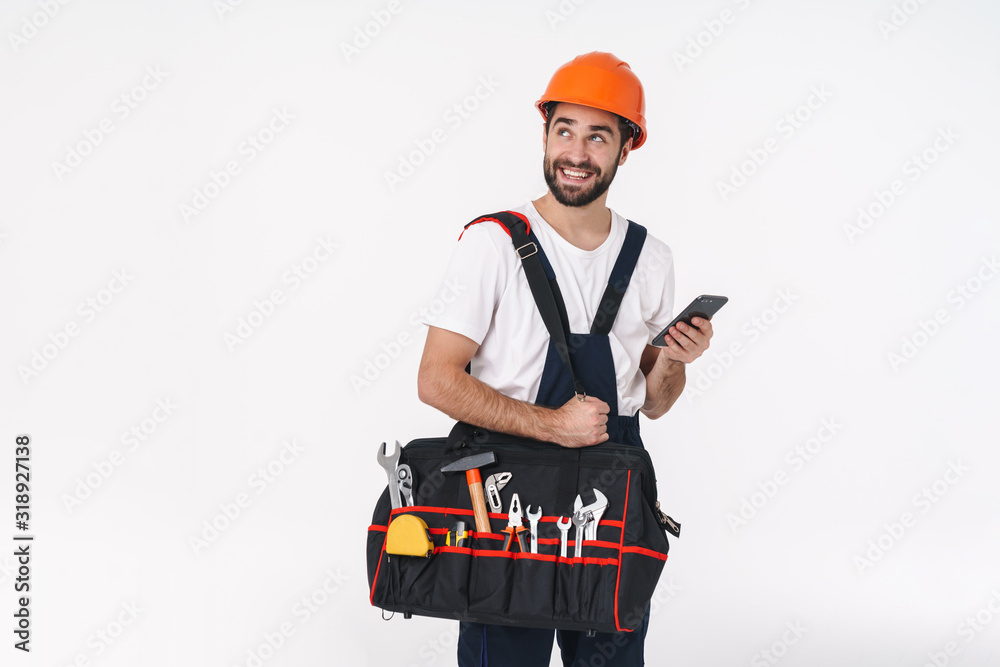 Sticker Optimistic young man builder holding bag with equipment