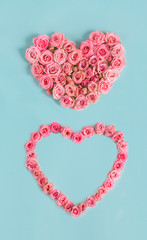 Valentine's day banner.Holiday card with a heart of pink roses on a blue background.Congratulation.Creative.diy.Women's day.Mother's day.love.postcard.Banner.Vertically.