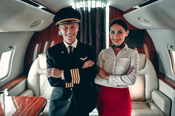 Pilot and flight attendant in private jet