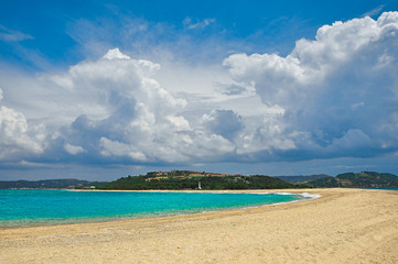 Fototapeta na wymiar Sandy beach on the azure sea coast