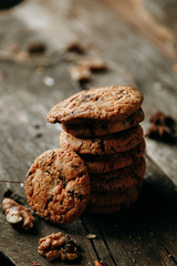 Baking on a Flatley wooden background. Oatmeal cookies with jam. Croissants with raspberry jam.