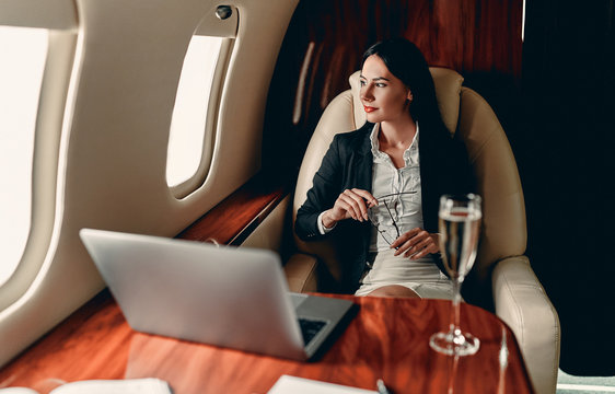 Business woman in private jet