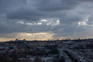 Istanbul/Turkey - 01.23.2020: A city view in Istanbul's old district Halicioglu with rays thought clouds
