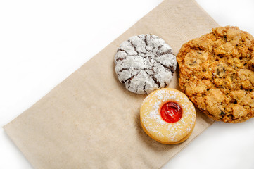 Delicious cookies on a paper bag isolated on white