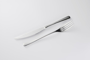 Fork and knife top view Stylish classy elegant metallic eating knife and fork cutlery for dining kitchen utensils Isolated on a white background, well lit. Kitchen set Flatware on white.