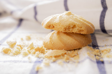 Cookies that are stacked on a white cloth