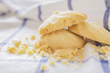 Cookies that are stacked on a white cloth