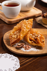 Oriental sweets with honey, nuts and cup of tea