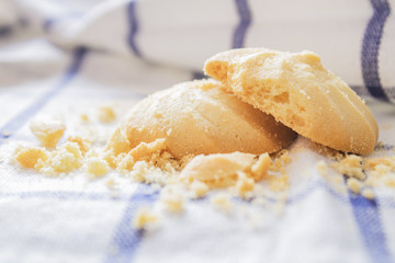 Cookies that are stacked on a white cloth