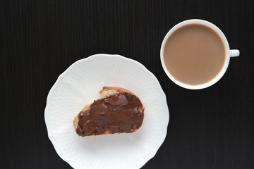 cup with coffee and sandwich with walnut, chocolate paste