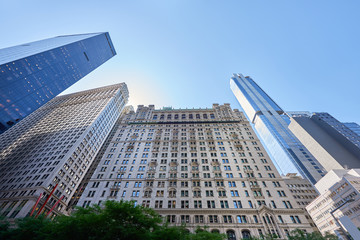 Wide shot of high, aged and modern buildings in New York.