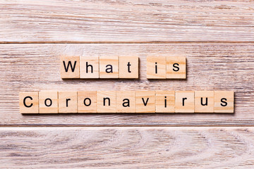 what is coronavirus word written on wood block. what is coronavirus text on wooden table for your desing, coronavirus concept top view