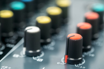 Close-up of volume buttons control of the audio mixer. Selective focus