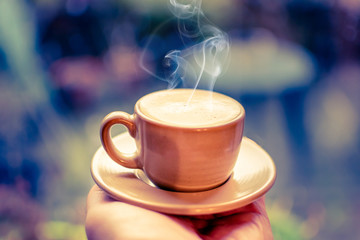 cup of espresso in hand