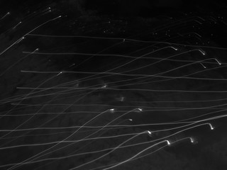 Light painting image representing many falling stars in the starry night. Abstract background