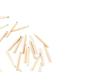 Huge set of colorful pencils on white wooden background. Top view.
