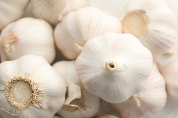 Fresh garlic bulbs textured background, close up