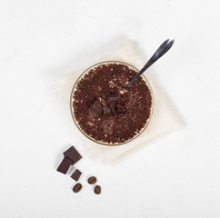 Panna cotta in a glass Cup, Italian dessert, creamy chocolate coffee jelly with chocolate pieces on a light background