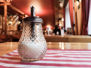 sugar bowl on a table in a restaurant