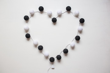 garland of balloons on a white background. Flat lay, top view