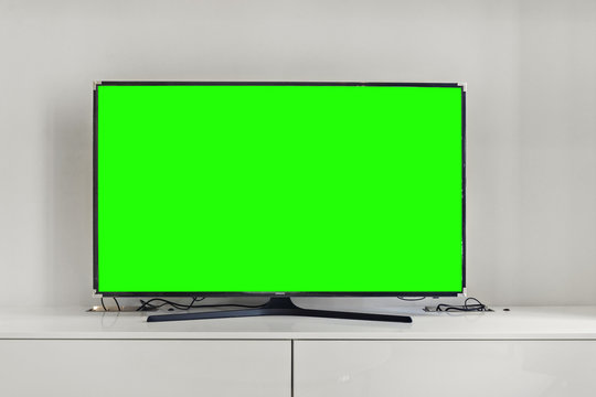 green screen on smart 4k TV, FHD Digital Television on white wall background