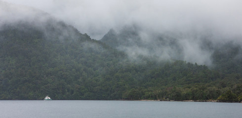 Clouds and fog at Doubtfull Sound. Fjordland New Zealand. South Island.