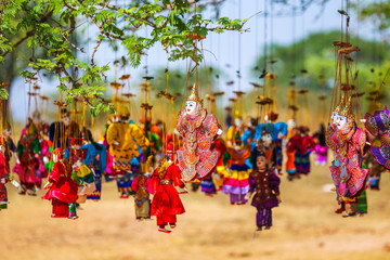Bright souvenirs and puppets on the market in the ancient pagoda in Bagan, Myanmar