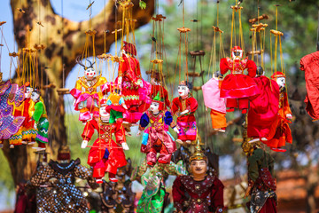 Bright souvenirs and puppets on the market in the ancient pagoda in Bagan, Myanmar