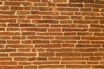 Obraz premium The texture of a brick wall of a thousand years old on an ancient pagoda in Burma