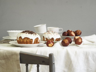 Easter baking with Easter eggs dyed with onion husks with imprints of fresh leaves, on a fabric canvas background. We meet Easter Sunday, tea drinking.