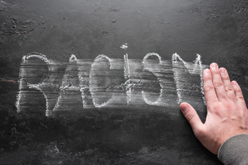 man erases the inscription racism concept stop racism selective focus