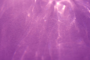 caustic effect, play of shadows on a purple background