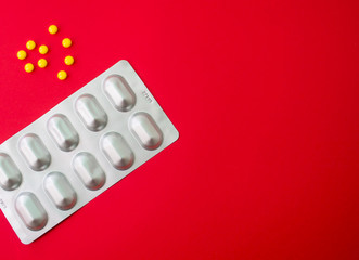 Epidemic concept in China. Pills on red background in the form of china flag. Free space for writing words.
