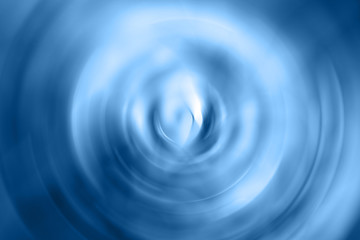 Blurred gradient radial motion classic blue background. Mixed circular texture of trendy color of the year