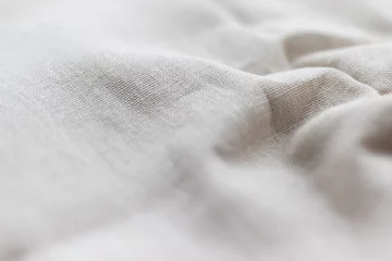 Gordijnen Natural linen fabric texture. Rough crumpled burlap background. Selective focus. Closeup view © MariiaDemchenko