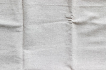 Soft light gray natural linen texture. Crumpled fabric background