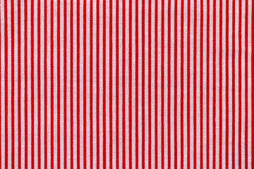 Red and white striped fabric texture. Bright colored cotton background