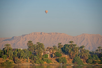 View of river nile in Egypt showing Luxor west bank with hot air balloon
