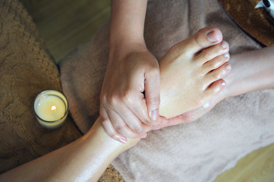Top view of foot massage in spa salon.